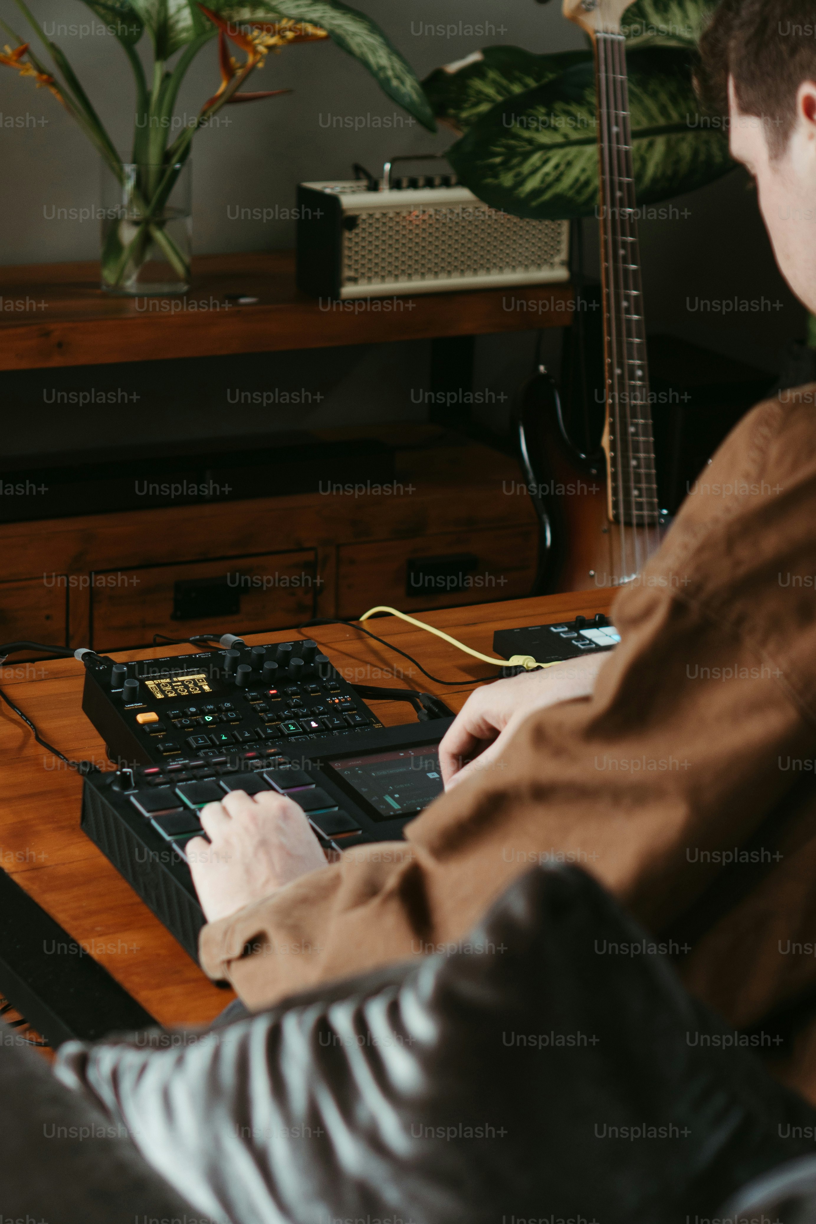 a man sitting at a table using a laptop computer