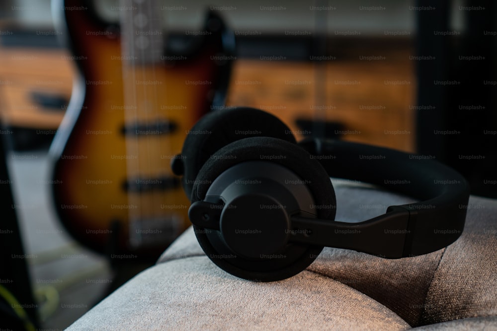 a pair of headphones sitting on top of a couch