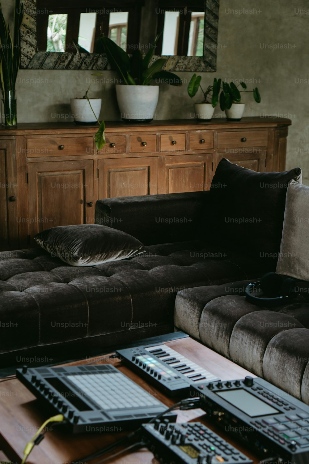 a living room filled with furniture and a large mirror