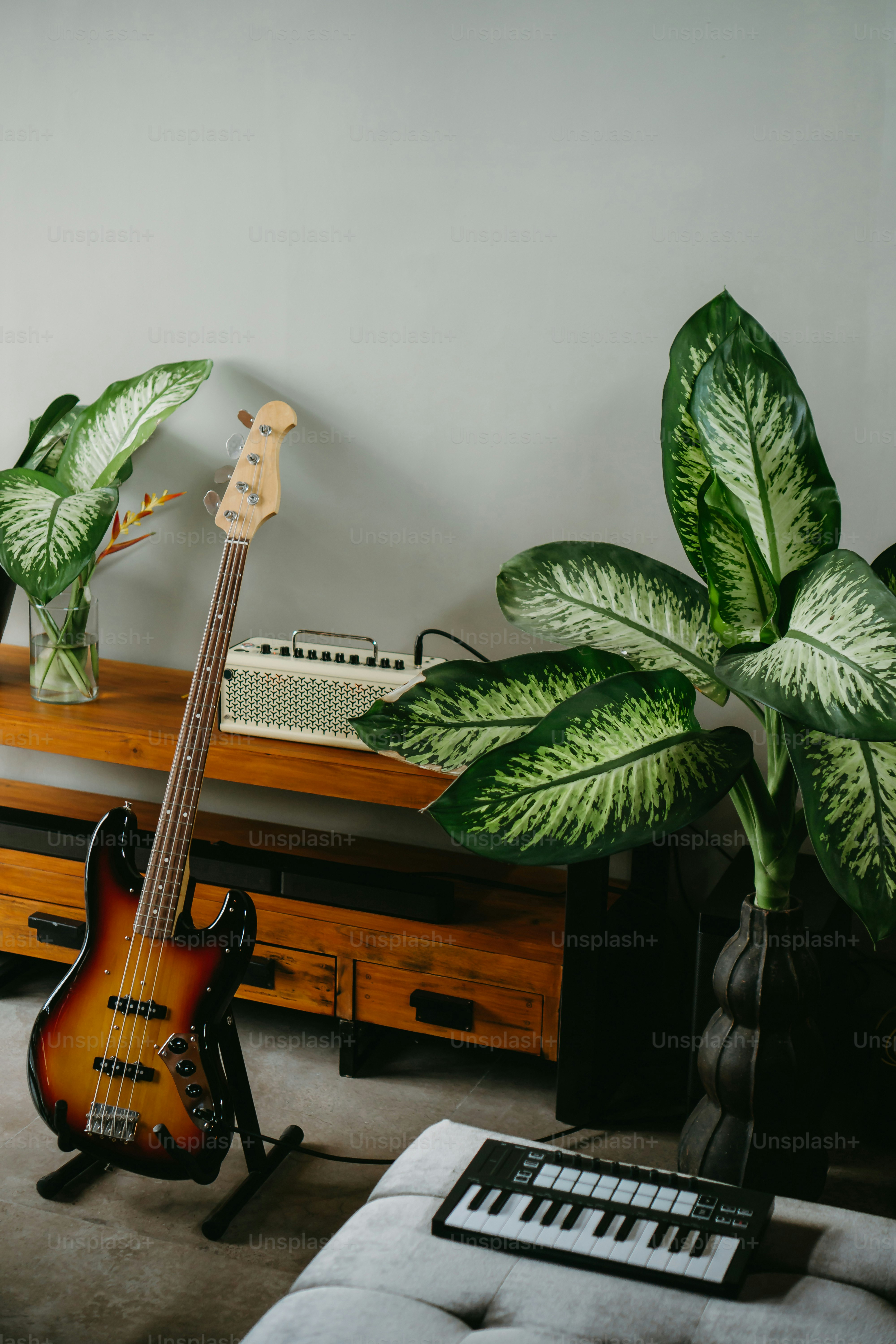 a guitar and a keyboard in a living room
