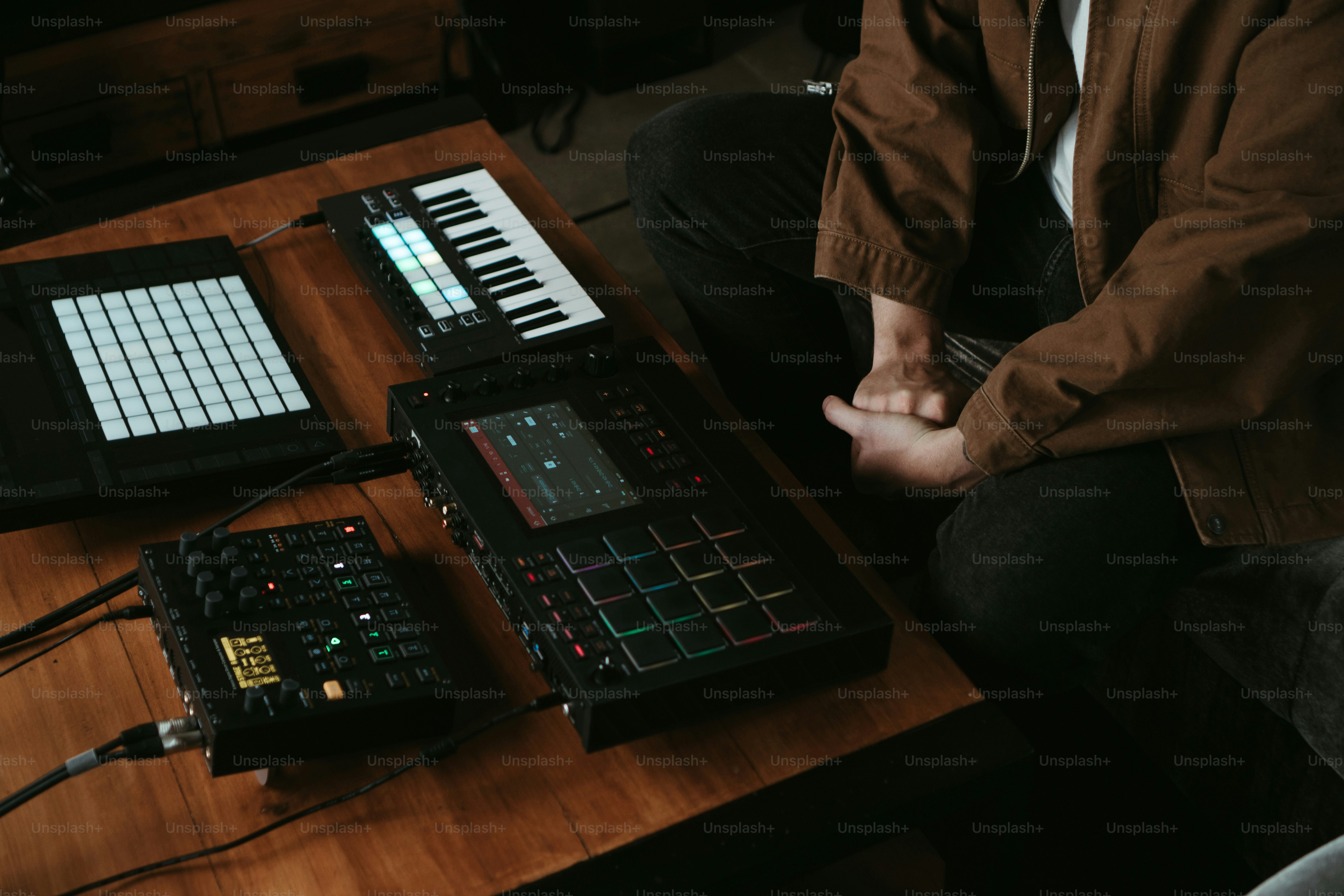 a person sitting at a table with a keyboard