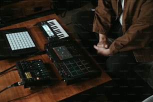 a person sitting at a table with a keyboard