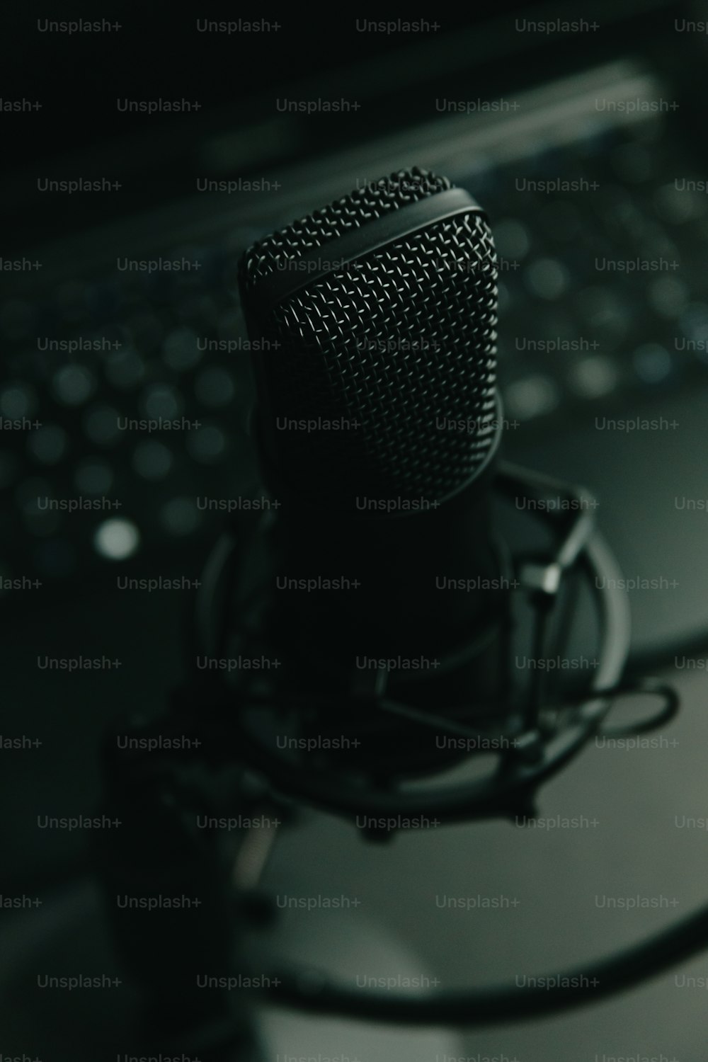 a microphone sitting in front of a laptop computer