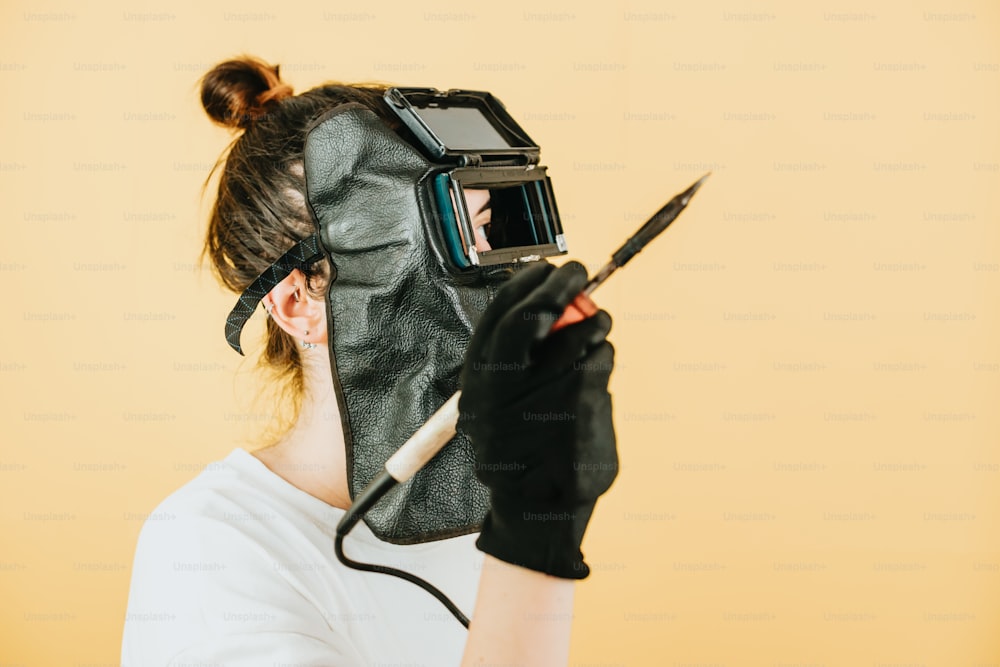 a woman wearing a mask and holding a knife