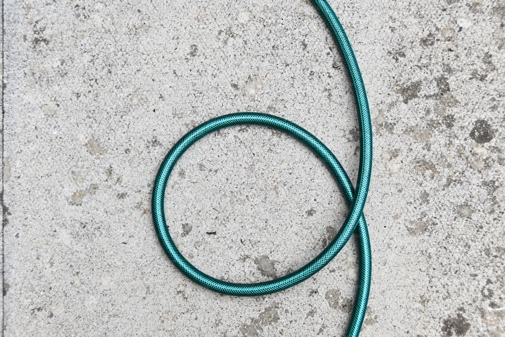 a close up of a hose laying on the ground