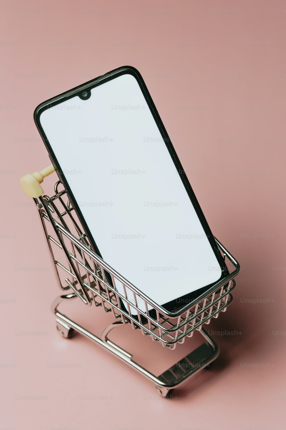 a shopping cart with a cell phone in it