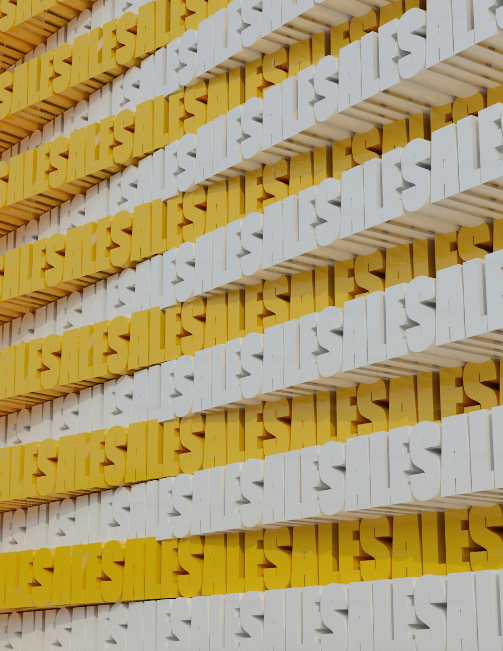 una pared amarilla y blanca que tiene un montón de letras amarillas y blancas