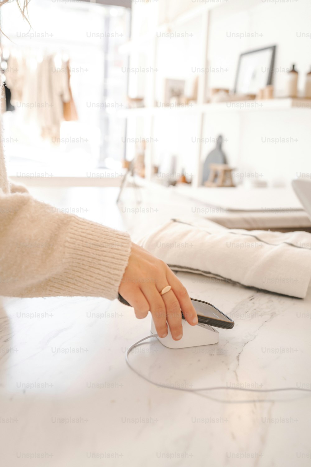 a woman using a computer mouse on a counter