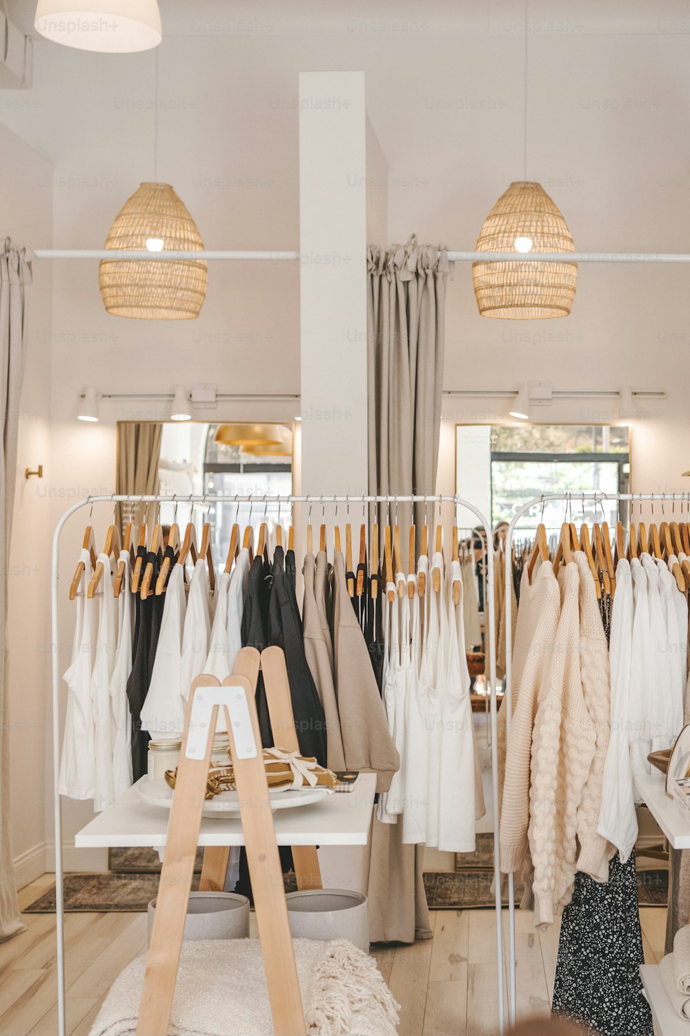 a clothing store with clothes hanging on racks