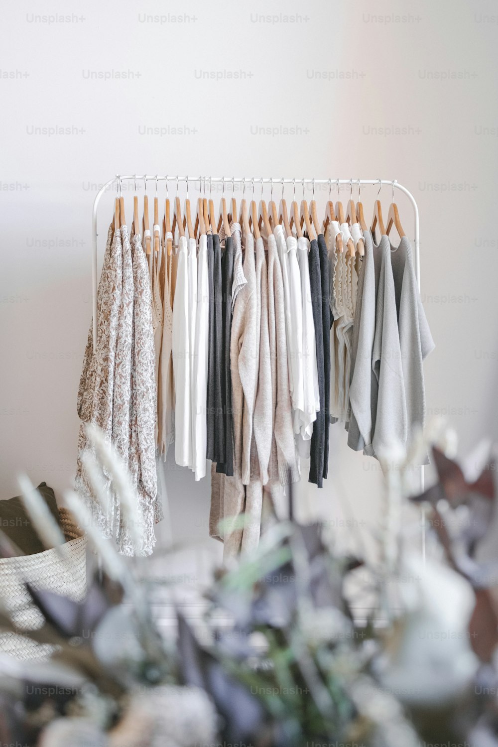 a rack of clothes hanging on a clothes line