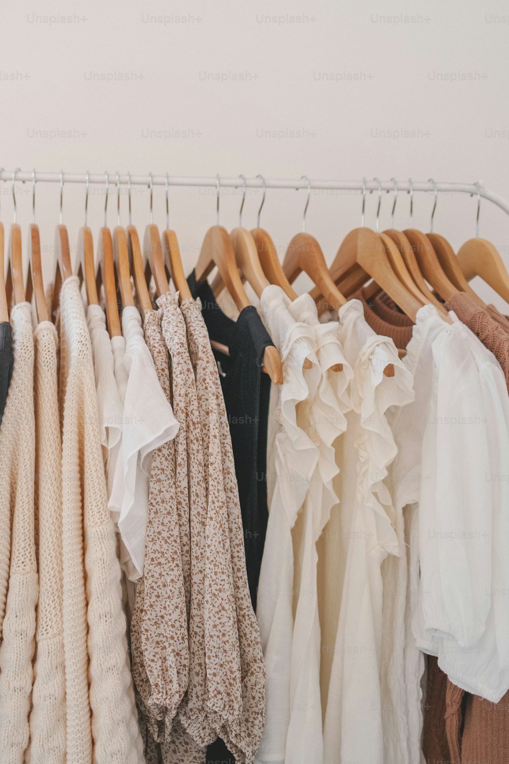 a rack of clothes hanging on a clothes rack