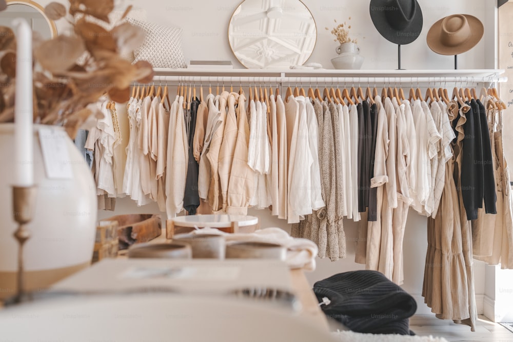 a rack of clothes and hats in a room