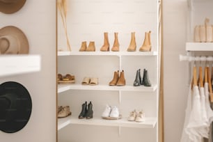 a closet filled with lots of shoes and hats