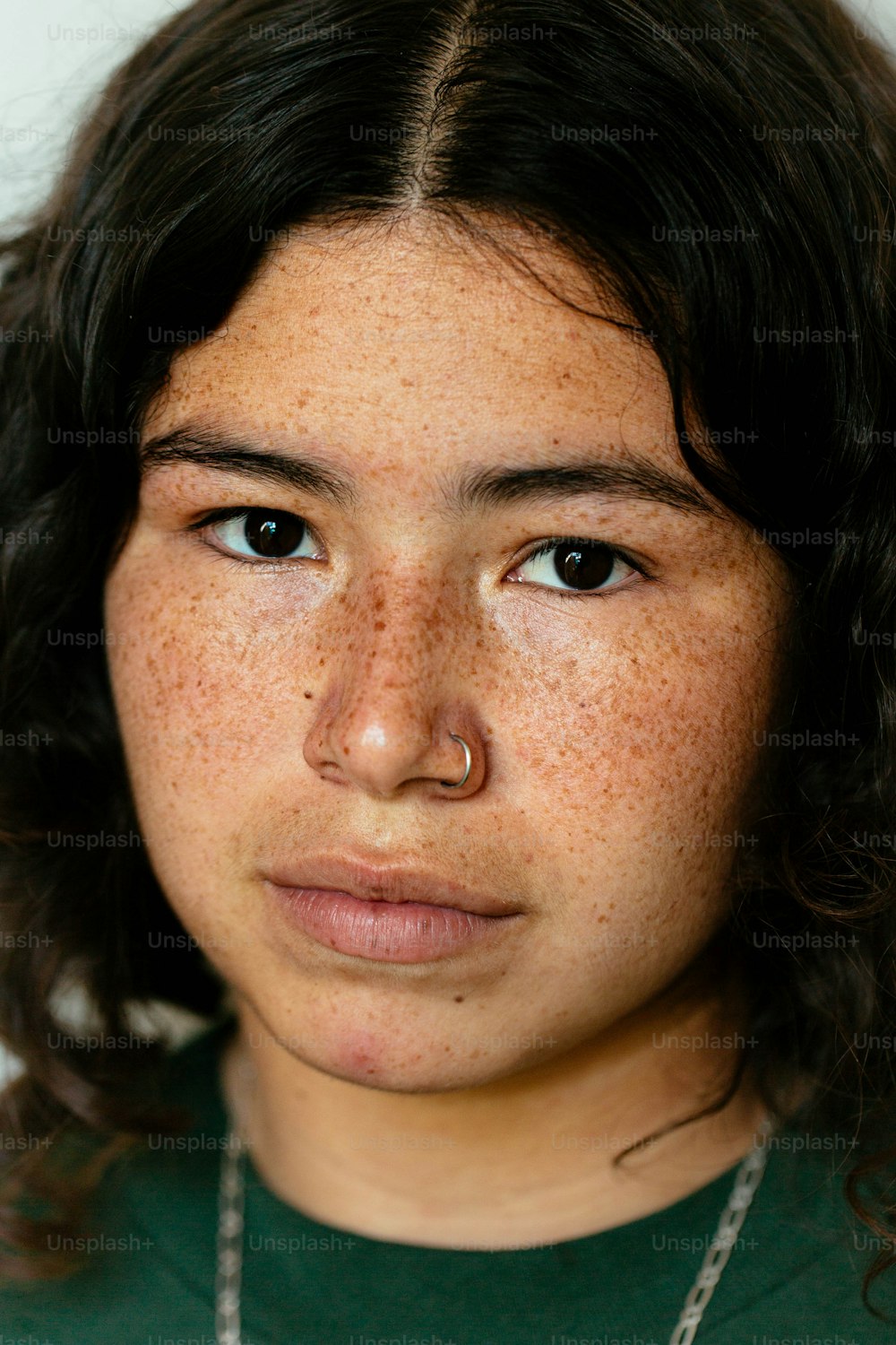 a close up of a person with freckles on her face