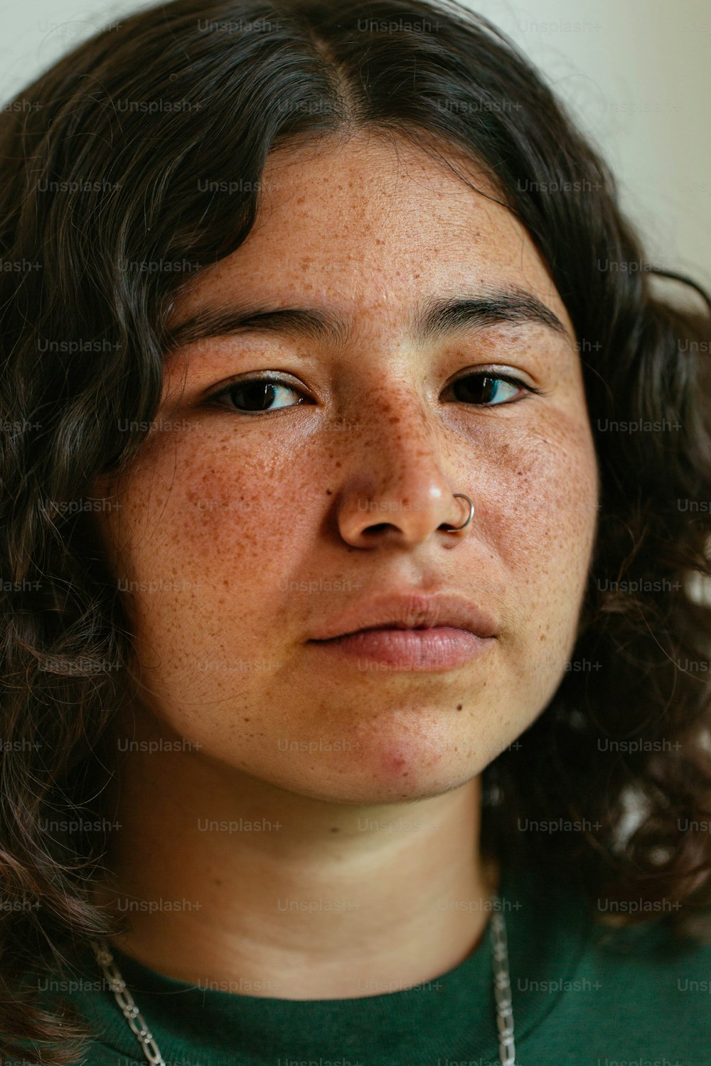 a close up of a person wearing a necklace