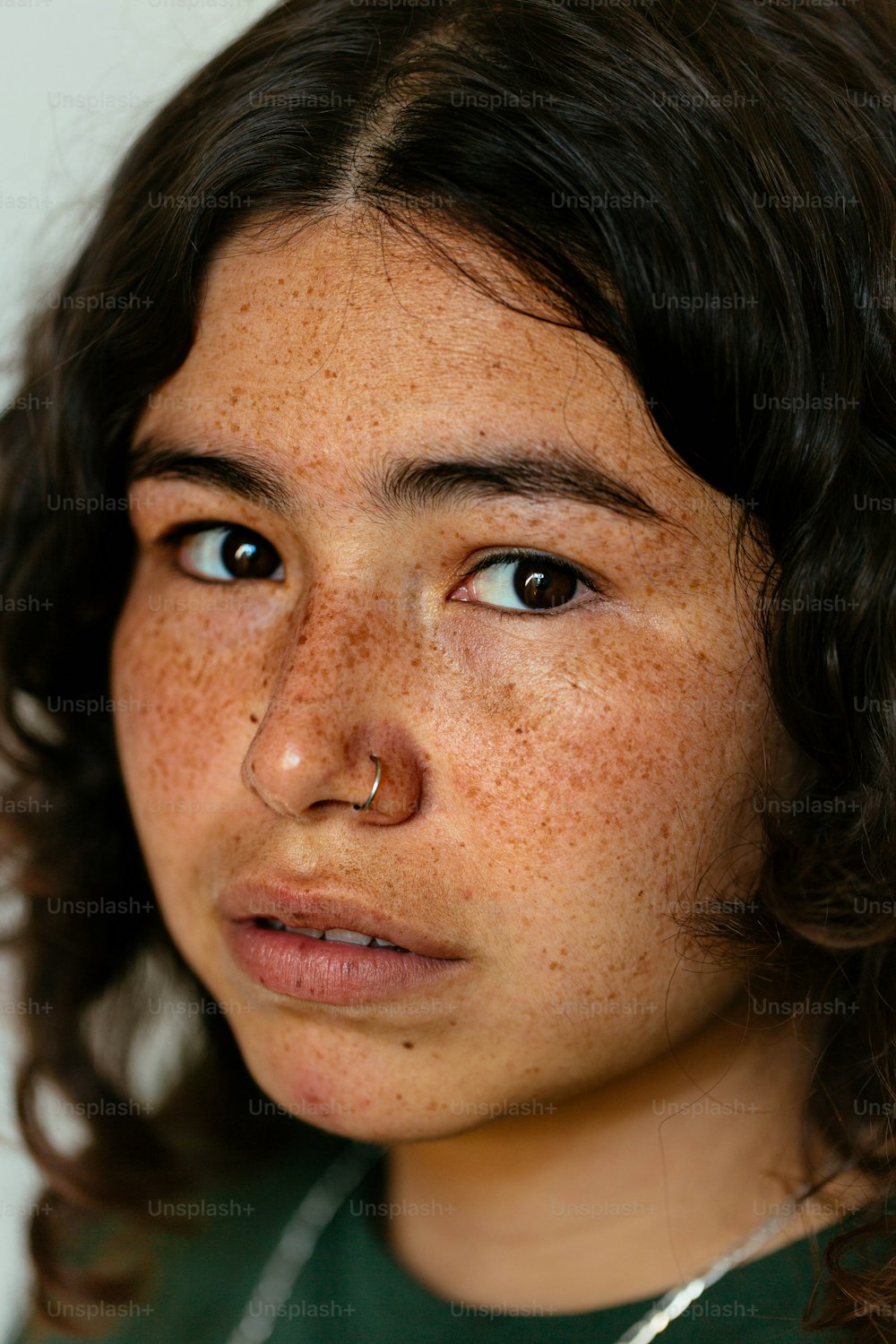 a close up of a person with freckles on her face