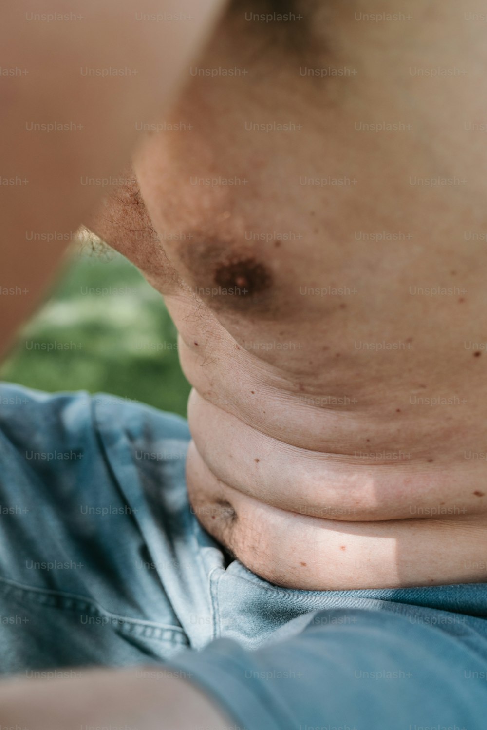 a close up of a man's neck and chest