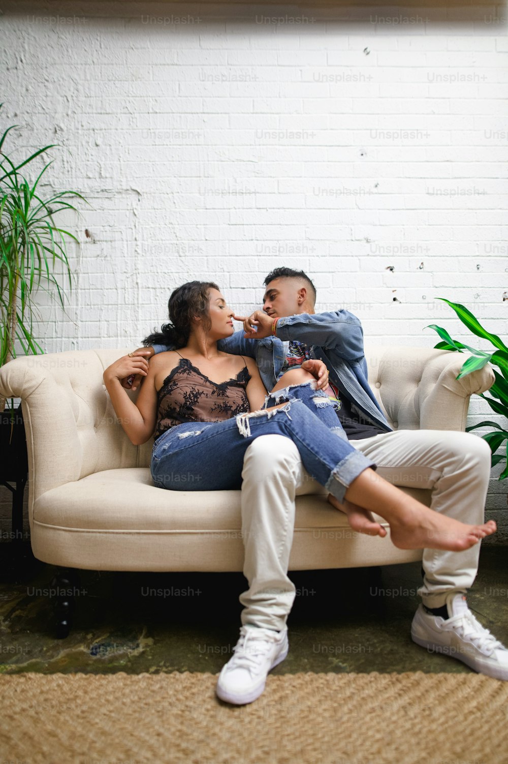 a man and a woman sitting on a couch