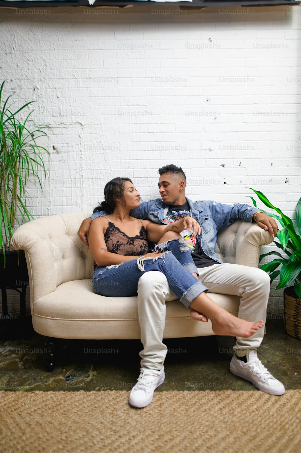 a man and a woman sitting on a couch