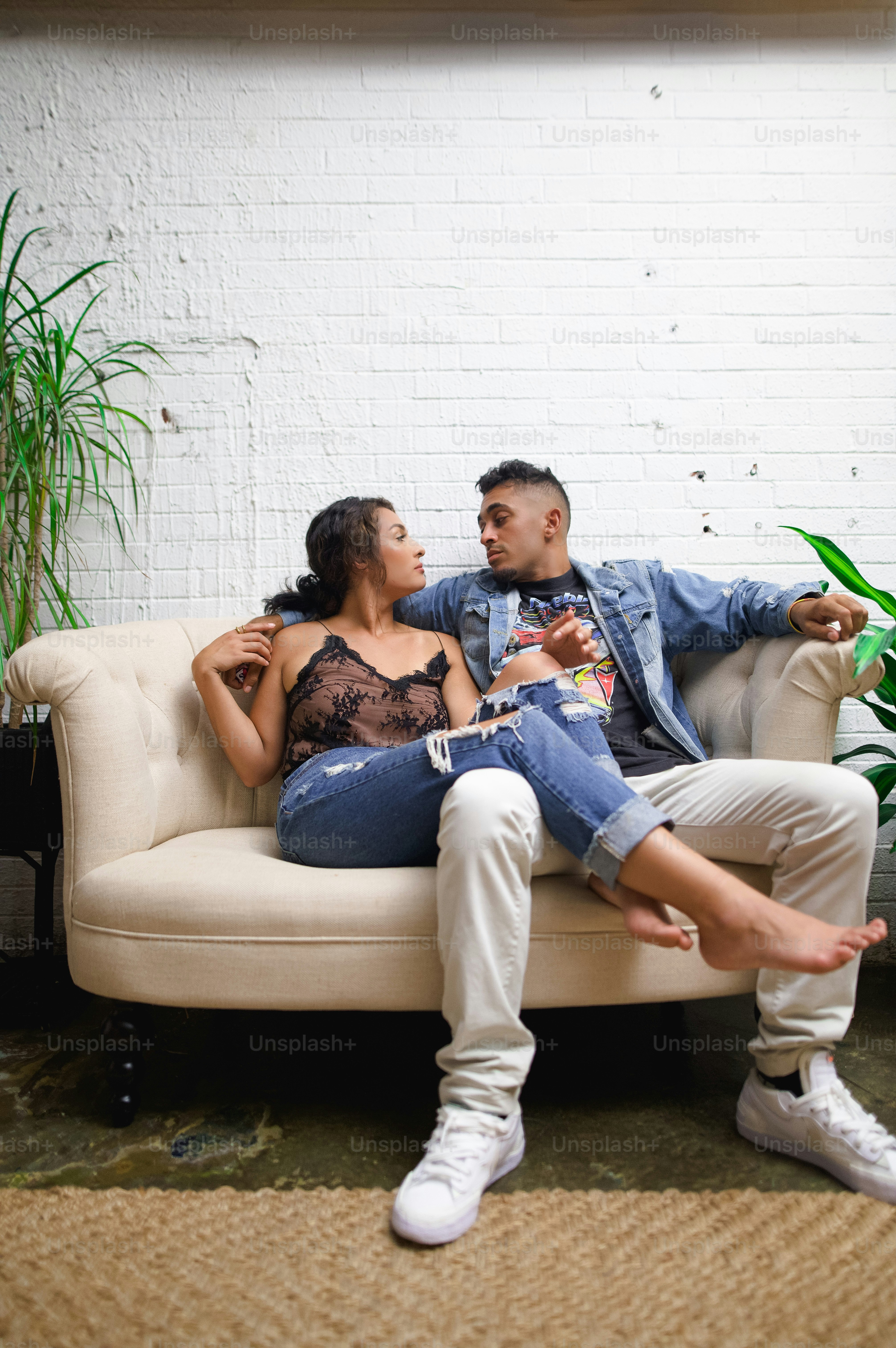 a man and a woman sitting on a couch