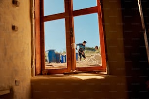 a couple of people that are looking out of a window