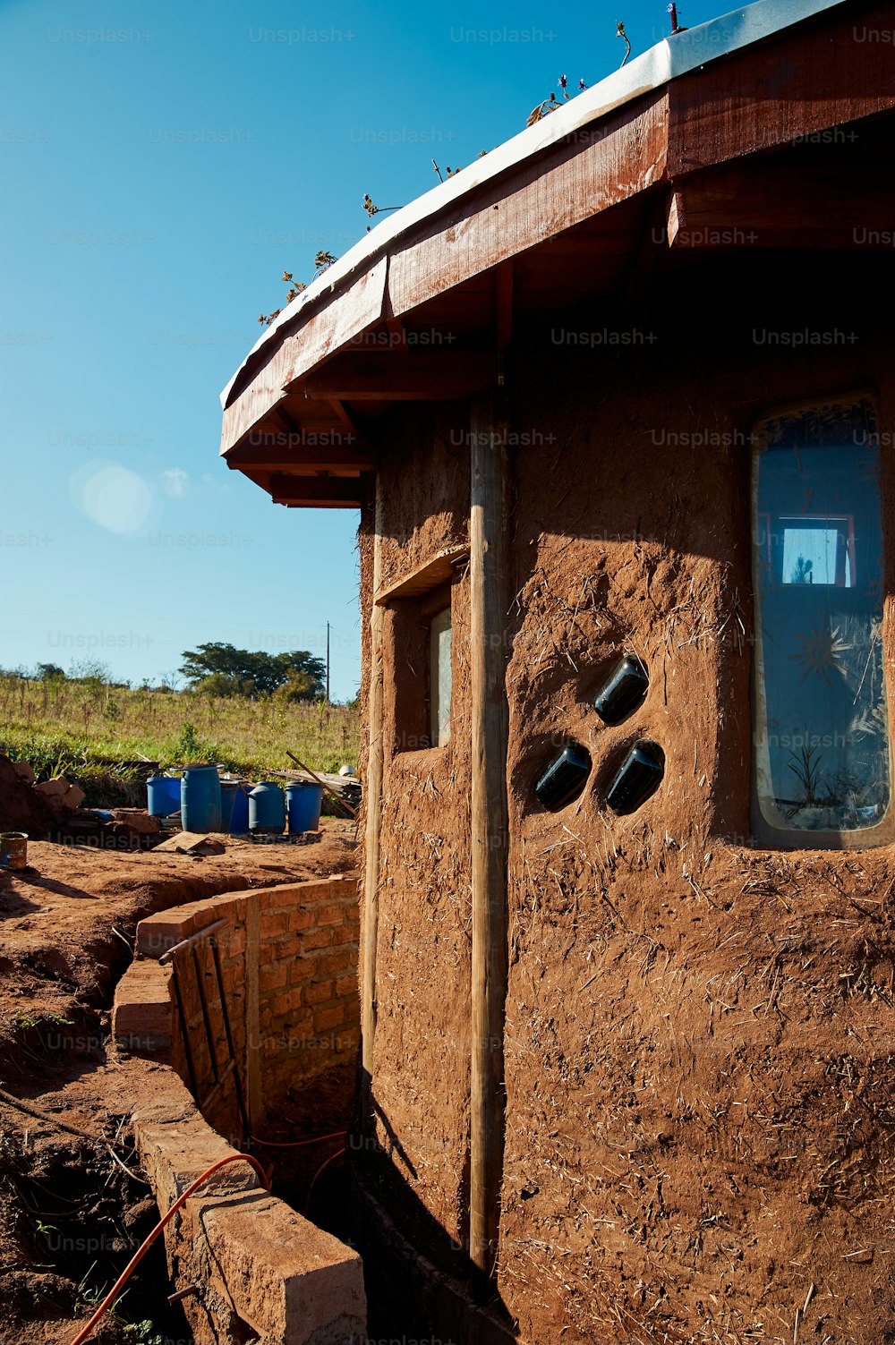 a building made of clay with holes in the side