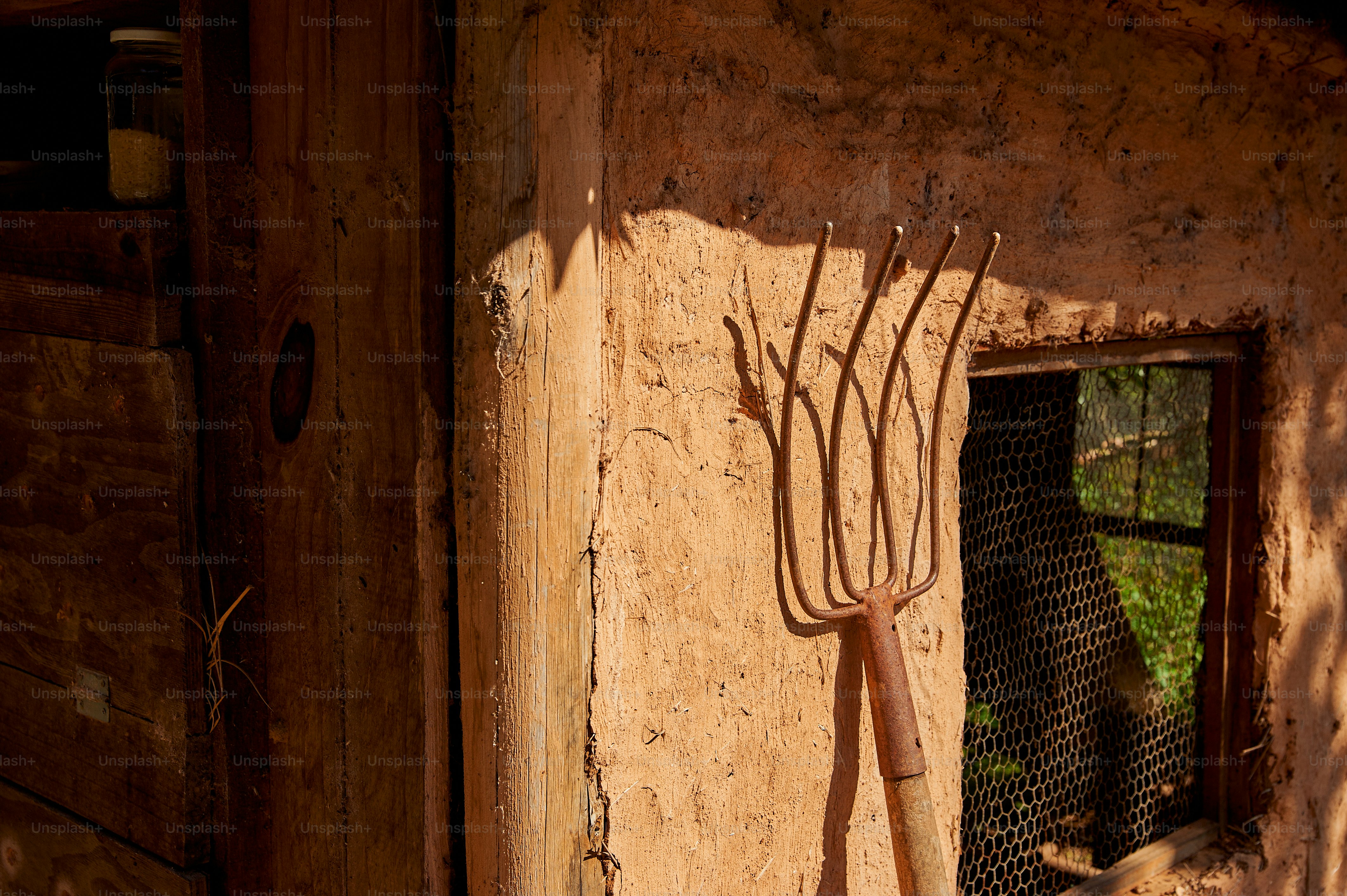 a pair of scissors hanging from the side of a building