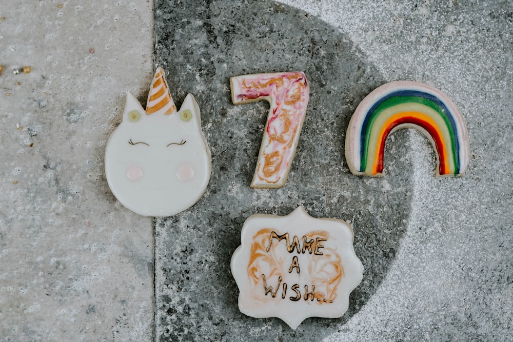 a cookie with a unicorn and a rainbow on it