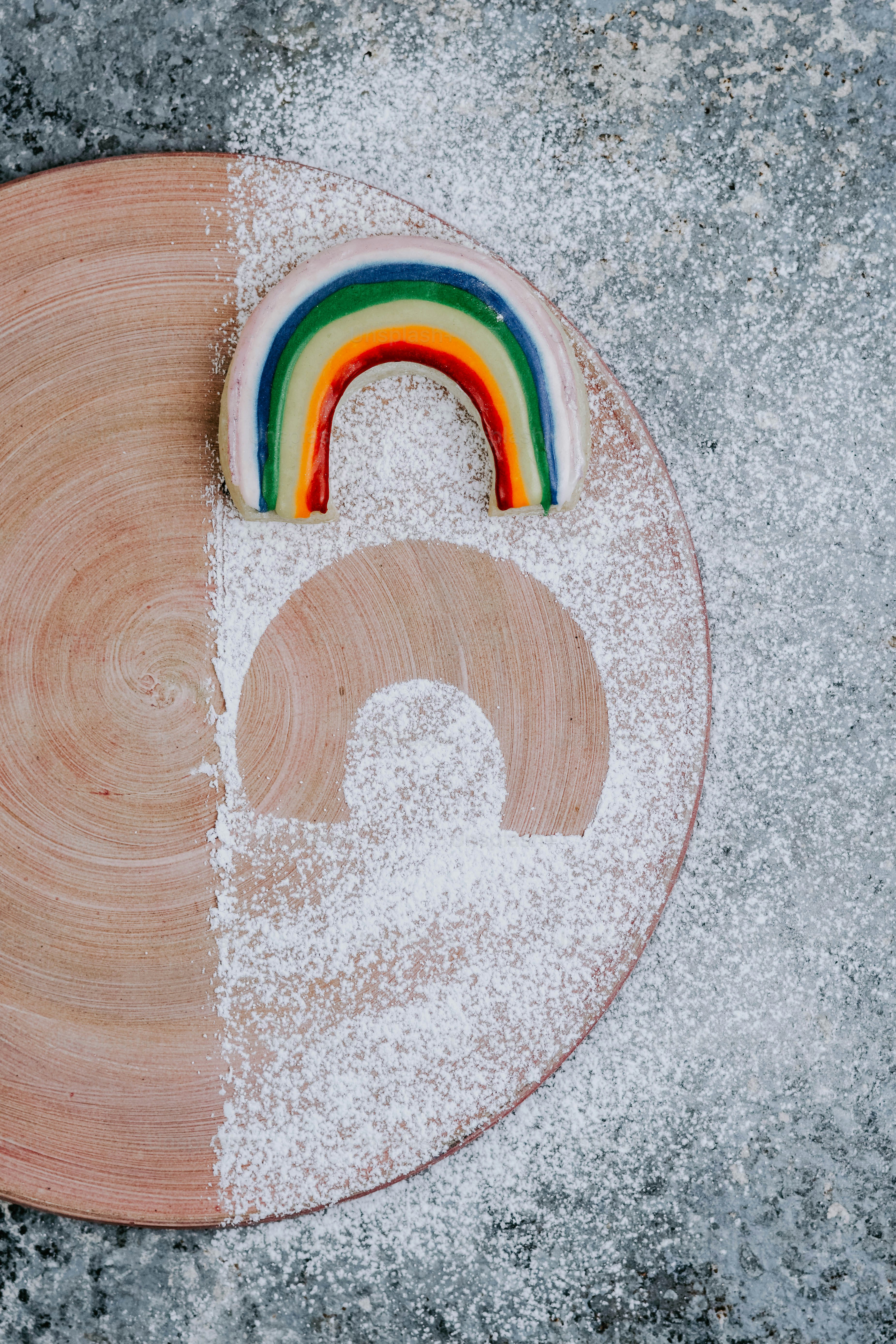 a cake with a rainbow on top of it