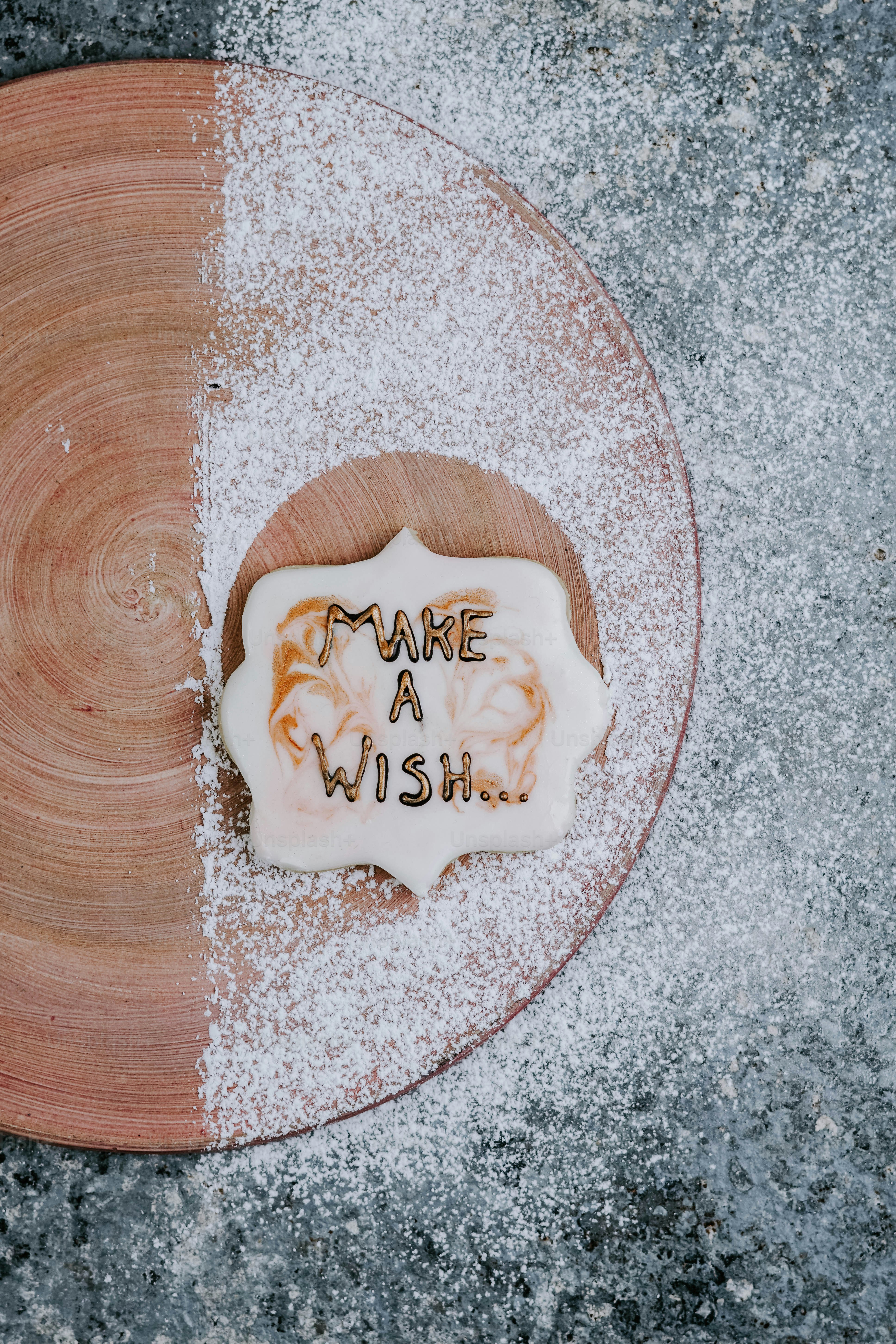 a wooden plate topped with a piece of cake