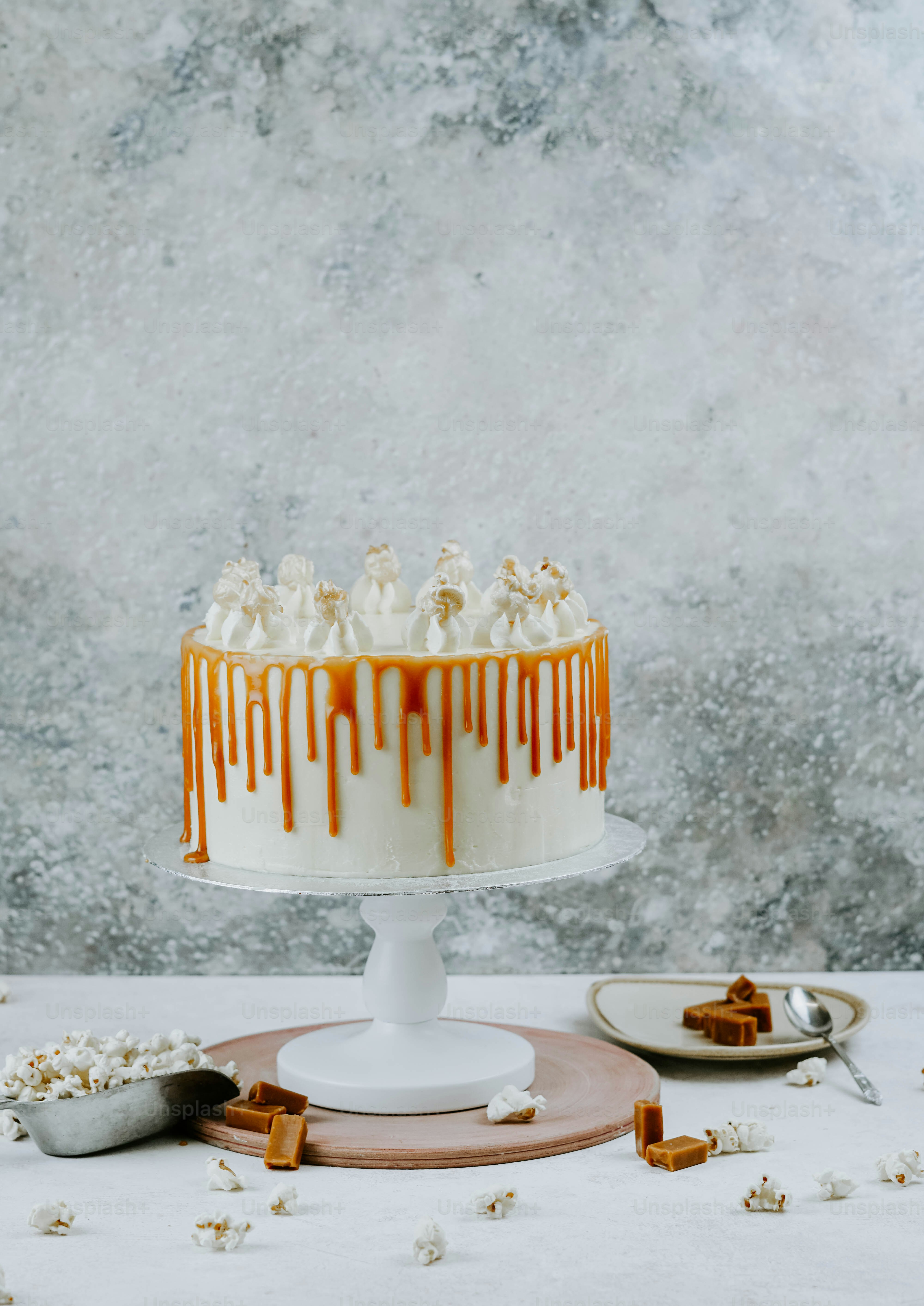 a white cake with caramel drizzled on top