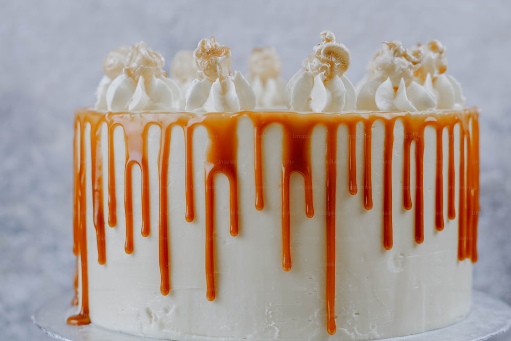 a close up of a cake with caramel drizzle