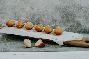 a bunch of doughnuts that are on a board