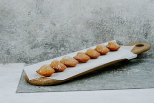 a tray of donuts sitting on top of a counter