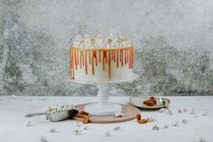 a white cake with caramel drizzled on top