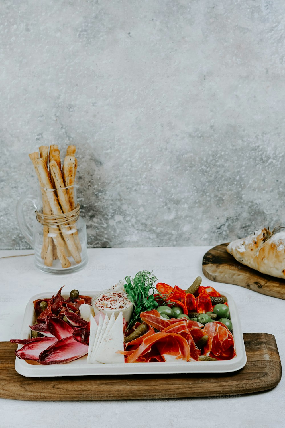 a plate of food on a wooden tray