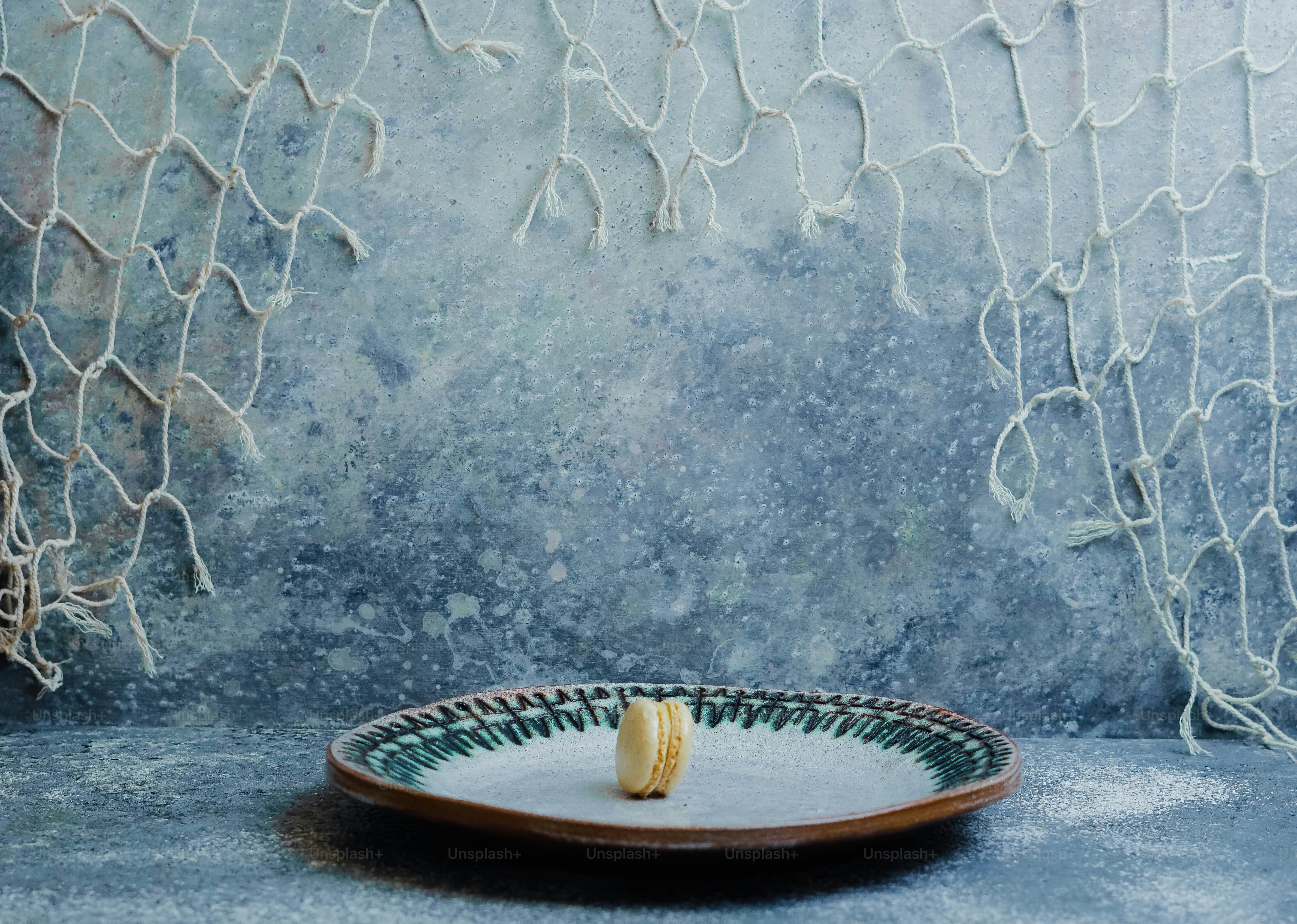 a plate with a piece of food on it