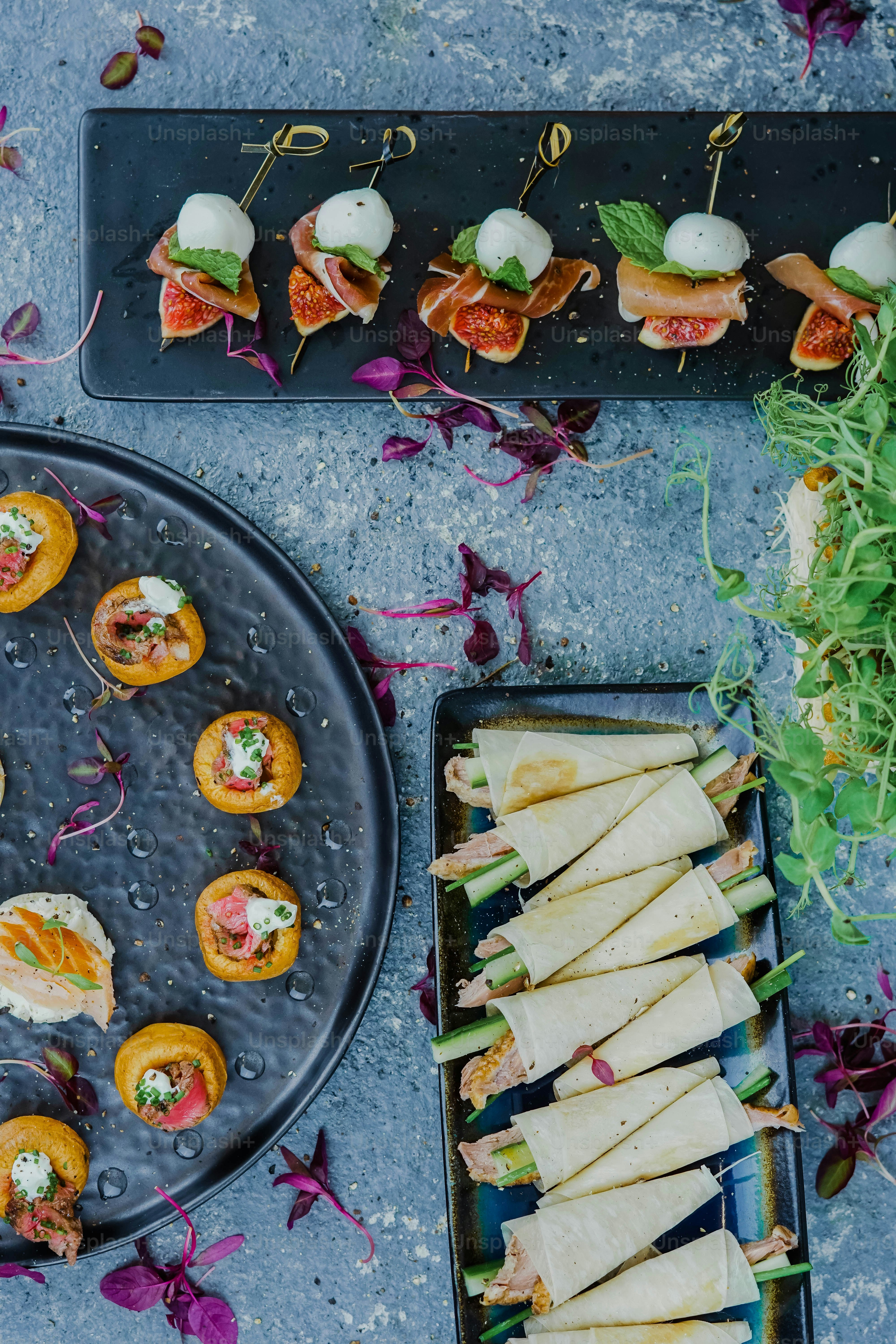 a platter of appetizers and a plate of appetizers
