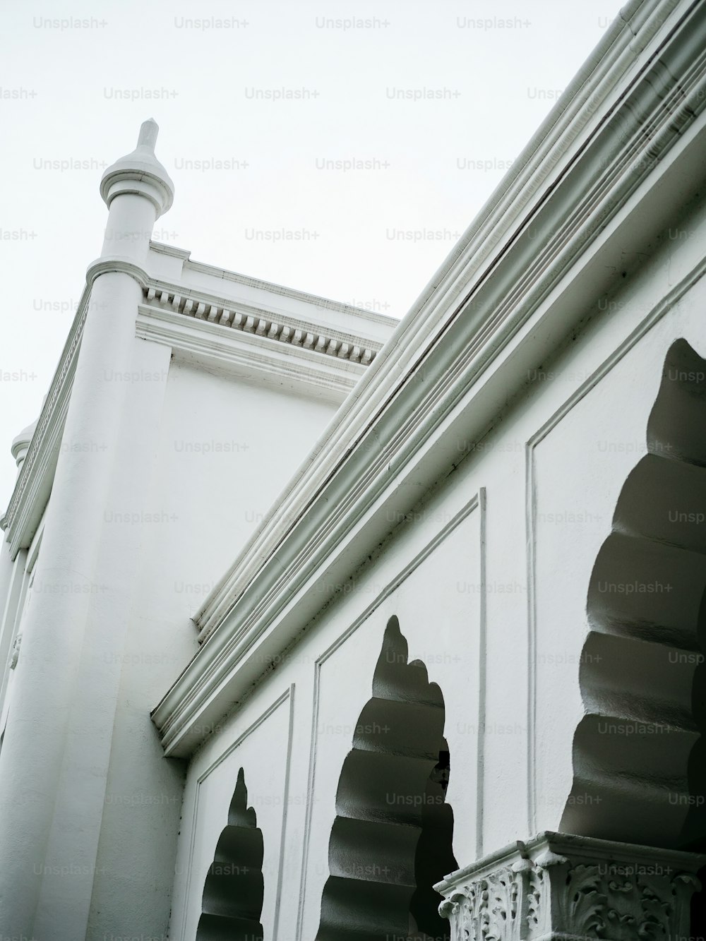 a black and white photo of a white building