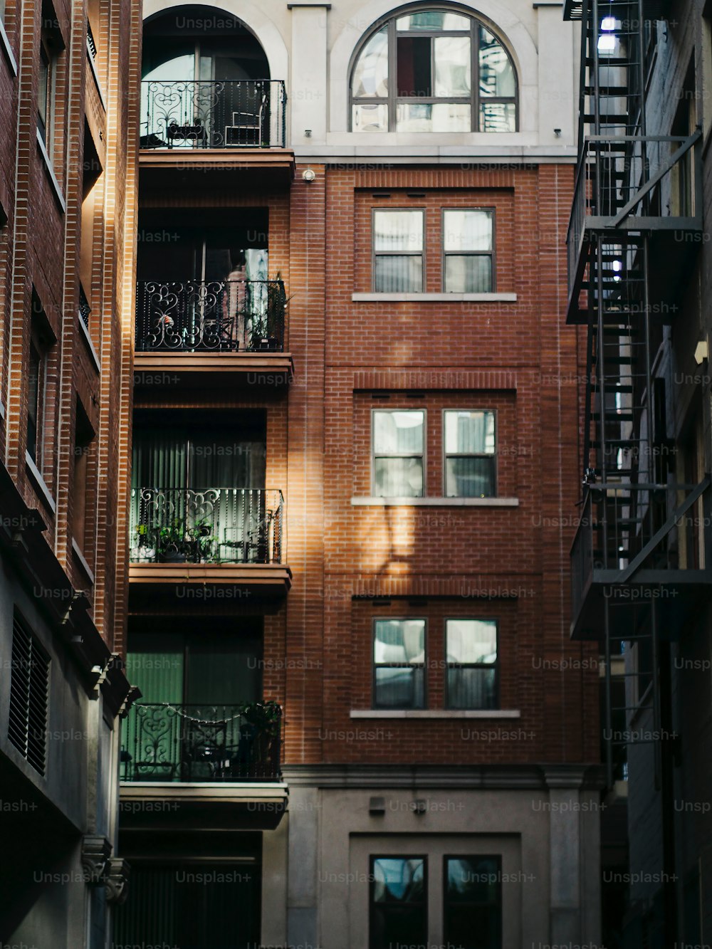 a tall brick building with lots of windows