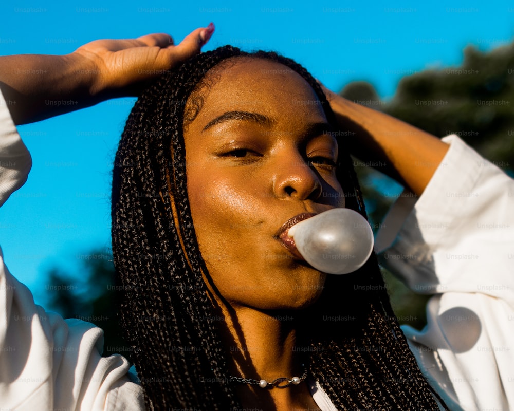 a woman with a pacifier in her mouth