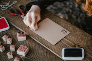 a person is writing on a piece of paper