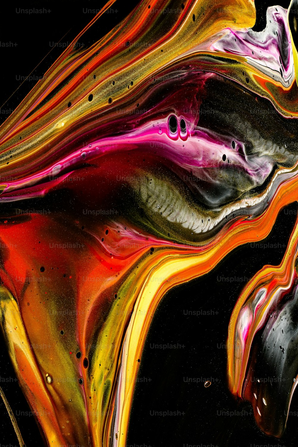 a close up of a colorful object on a black background