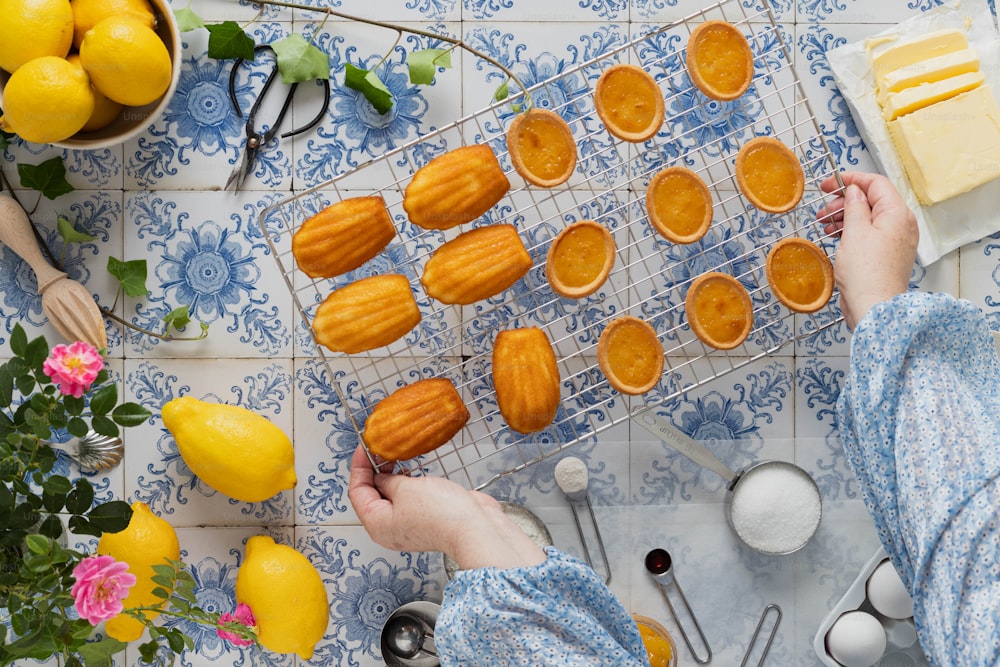 a person is decorating a table with lemons