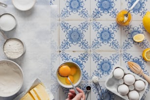 a person is mixing ingredients for a cake