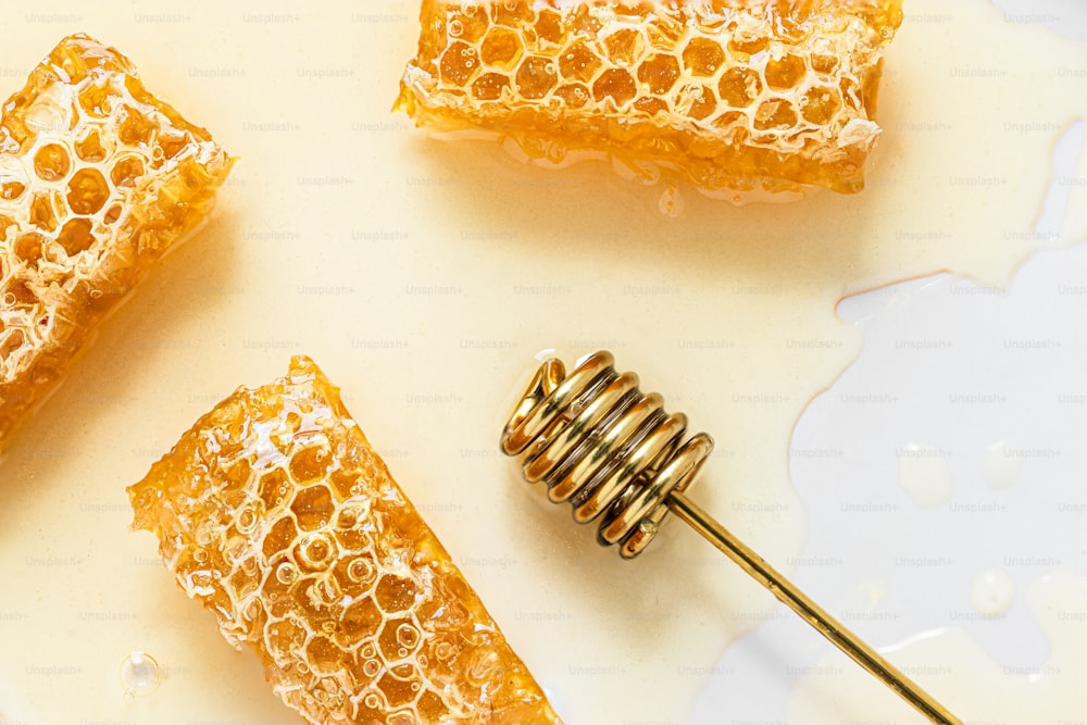 honeycombs and a honey comb on a white surface