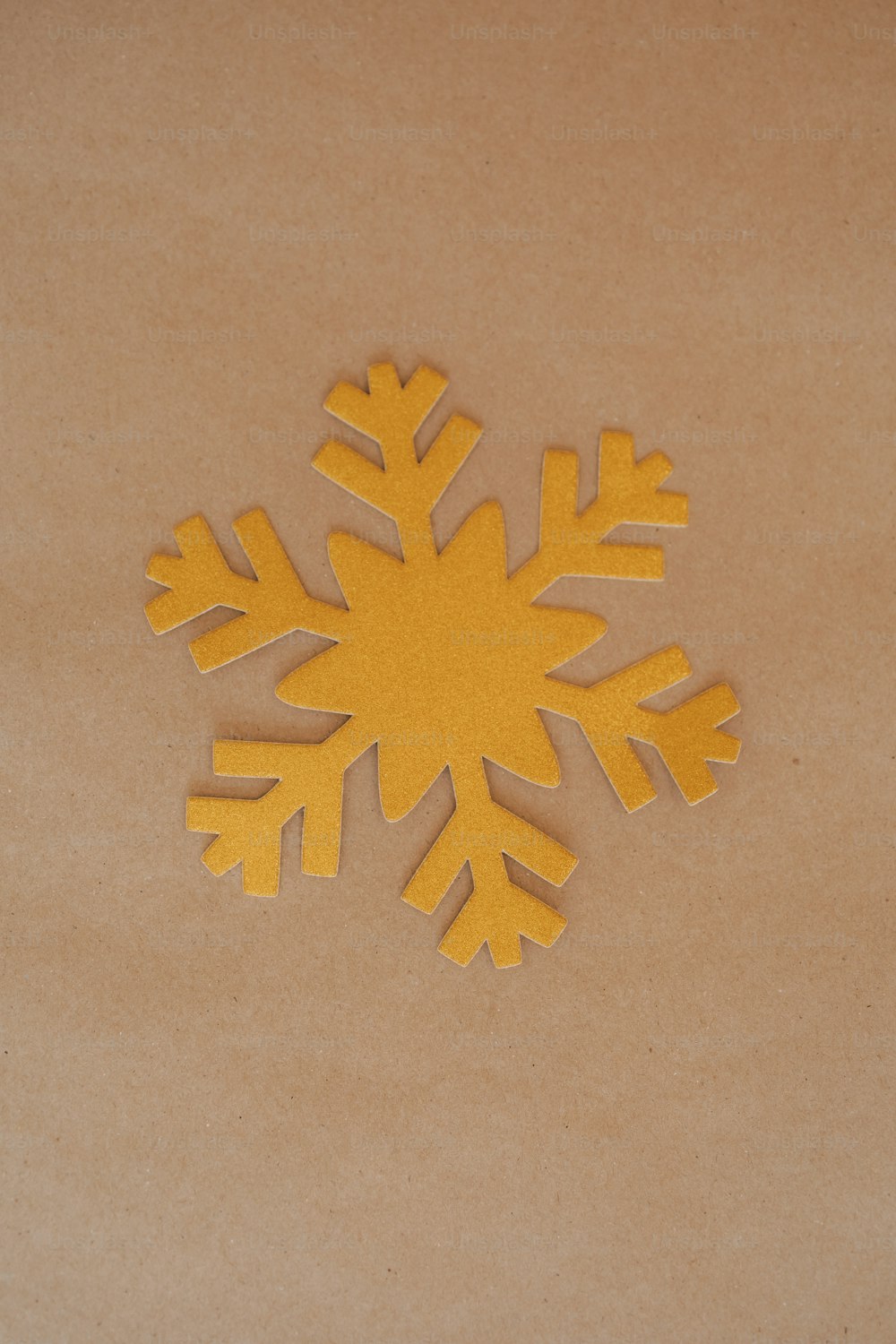 a yellow snowflake sitting on top of a table