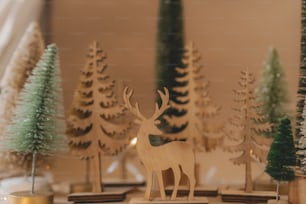 a close up of a wooden deer on a table