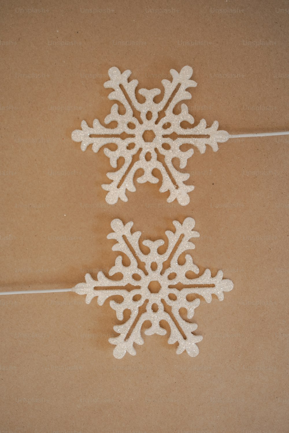 a pair of snowflakes sitting on top of a table