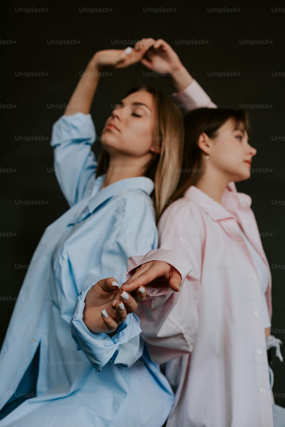 a couple of women standing next to each other